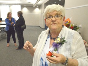 Elaine Lewis showed up to her retirement celebration early and was able to snag a few strawberries before people from the school boards, teachers, and other people arrived. Lewis is retiring after volunteering and working as Chatham-Kent's Student Nutrition Program Coordinator for nearly three decades. (Louis Pin/Postmedia Network)