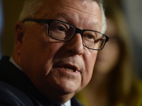 Public Safety Minister Ralph Goodale speaks to the media in the House of Commons foyer on Parliament Hill in Ottawa on Thursday, June 16, 2016. THE CANADIAN PRESS/Adrian Wyld