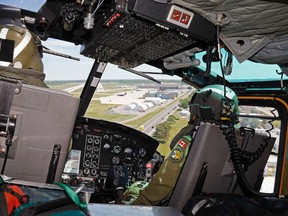 Luke Hendry/The Intelligencer 
Capt. Rich Gough, left, of Strathroy, Ont. and Capt. Stef Pouliot of Montreal fly their CH-146 Griffon helicopter to land at Canadian Forces Base Trenton. The flight by members of  424 "Tiger" Transport and Rescue Squadron was part of a promotion for the Quinte International Air Show, which runs June 25-26 at the base.