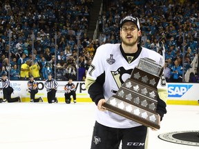 Sidney Crosby of the Pittsburgh Penguins is awarded the Conn Smythe award after his teams 3-1 victory to win the Stanley Cup against the San Jose Sharks in Game 6 of the Stanley Cup final at SAP Center in San Jose on June 12, 2016. (Bruce Bennett/Getty Images/AFP)