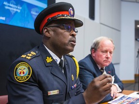 Toronto Police Service Chief Mark Saunders (left) and Toronto Police Services Board chair Andy Pringle address media at a TPSB meeting on Thursday June 16, 2016. (Ernest Doroszuk/Toronto Sun)