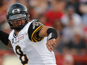 One of Tiger-Cats quarterbacks Jeremiah Masoli (right) and Jeff Mathews will get the start against the Argos to begin the season. Only time will tell which one earns it. (Postmedia Network)