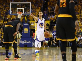 Stephen Curry of the Golden State Warriors gestures during the second half against the Cleveland Cavaliers in Game 5 of the NBA Finals at ORACLE Arena in Oakland on June 13, 2016. (Ezra Shaw/Getty Images/AFP)