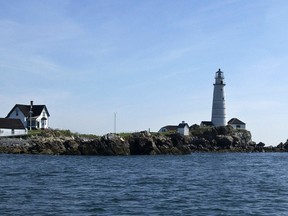 In this Aug. 23, 2004 file photo Boston Light sits on Little Brewster Island in Boston Harbor. Boston Light, the nation's first and oldest lighthouse, and the U.S. Coast Guard's last manned station, is celebrating 300 years of warning mariners as they navigate the tricky waters of Boston Harbor. (AP Photo/Josh Reynolds, File)
