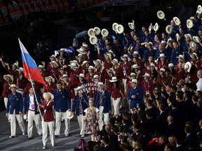 Russia's Maria Sharapova carries the flag during the Opening Ceremony at the 2012 Summer Olympics in London on July 27, 2012. The IAAF has reportedly extended the ban of Russia's track and field athletes through the 2016 Rio de Janiero Olympics.  (AP Photo/Paul Sancya, file)