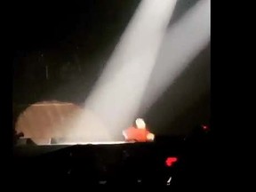 Justin Bieber falls through a hole in the stage during a concert at Saskatoon's SaskTel Centre. (YouTube screen shot)