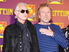 In this Oct. 9, 2012 file photo, Led Zeppelin guitarist Jimmy Page, left, and singer Robert Plant appear at a press conference ahead of the worldwide theatrical release of "Celebration Day," a concert film of their 2007 London O2 arena reunion show, in New York. (Photo by Evan Agostini/Invision/AP, File)