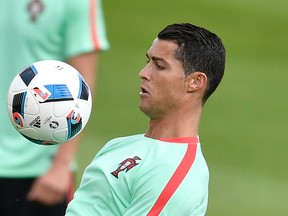Portugal’s Cristiano Ronaldo works out during a training session in Marcoussis, France, Friday, June 17, 2016. (AP Photo/Martin Meissner)