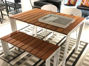 From Design Within Reach on King St. E.: The teak table exudes a 
visual warmth and the stackable chairs help with storage.
