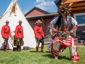 Darren Morin leads the procession during the Enoch RCMP Detachment opening celebrations on Enoch Cree Nation on Friday, June 10, 2016. Almost three years to the day from when ground was first broken, this detachment has been long-awaited by the community. - Photo by Yasmin Mayne