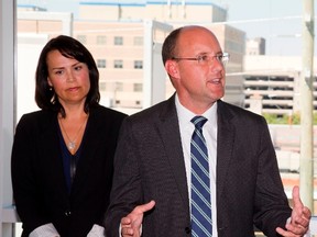 London Mayor Matt Brown answers questions after he announced the mayor?s advisory panel on poverty last September. Beside him is one of the panel?s co-chairs, then deputy mayor Maureen Cassidy. Cassidy and Brown took leaves of absence this week after revealing they had an affair. (London Free Press file photo)