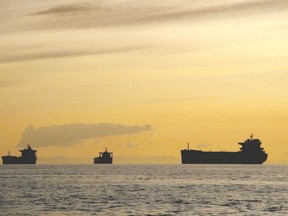 Ships moor in the Strait of Georgia off of Vancouver. (Canadian Press file photo)