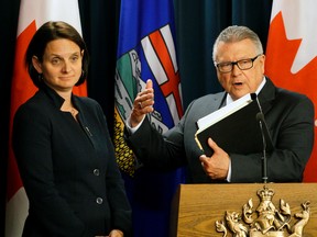 Danielle Larivee (left/Alberta Minister of Municipal Affairs) and Ralph Goodale (right/Federal Minister of Public Safety and Emergency Preparedness) discussed the wildfire recovery plans for Fort McMurray at a meeting held at the Alberta Legislature in Edmonton on June 17, 2016.
