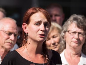 Sharlene Bosma, with her family and that of her late husband Tim Bosma, makes a statement in front of the John Sopinka Courthouse in Hamilton following the guilty verdicts of Dellen Millard and Mark Smich on Friday, June 17, 2016. THE CANADIAN PRESS/Peter Power