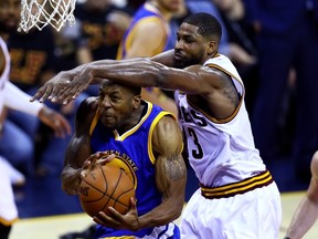 Cavaliers’ Tristan Thompson defends against Golden State Warriors’ Andre Iguodala during Game 6 on Thursday night. (AFP)