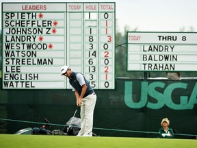 Andrew Landry of the United States putts on the ninth hole during the continuation of the weather delayed first round of the U.S. Open at Oakmont Country Club in Oakmont, Pa., on June 17, 2016. (Ross Kinnaird/Getty Images/AFP)