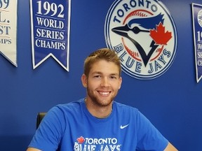 First-round draft pick T.J. Zeuch signs his first professional contract with the Toronto Blue Jays. (COURTESY TORONTO BLUE JAYS)