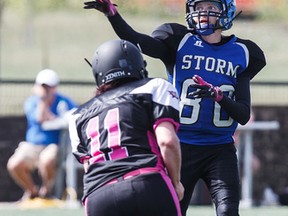 Edmonton's Aria McGowan, right, makes a pass under pressure from Grand Prairie's Kelsey Johnson during a game between the Edmonton Storm and the Grand Prairie Anarchy at Clareview Recreation Centre in Edmonton on May 7, 2016.