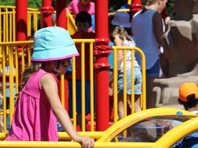 A child plays on the new playground in Springbank Park funded by talk-show host Jenny Jones. (Free Press file photo)