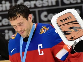 Russian forward Pavel Datsyuk skates with the trophy after winning the bronze medal at the world championship in Moscow on May 22, 2016. (AFP PHOTO/ALEXANDER NEMENOV)