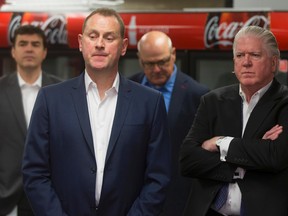 Calgary Flames GM Brad Treliving (left) and president of hockey operations Brian Burke. (Lyle Aspinall, Postmedia Network)