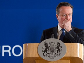 In this Friday, June 26, 2015 file photo, British Prime Minister David Cameron pauses before speaking during a media conference at an EU summit in Brussels.  Opinion polls suggest a vote could go either way on June 23, 2016 when Britain chooses whether to leave the 28-nation bloc it joined in 1973. (AP Photo/Virginia Mayo, File)