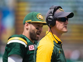 Edmonton Eskimos head coach Jason Maas and quarterback Mike Reilly watch the play against the Saskatchewan Roughriders during pre-season CFL action at The Brick Field at Commonwealth Stadium on June 18 2016, in Edmonton.