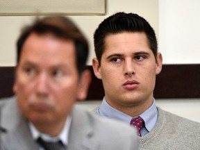 Brandon Vandenburg, right, a former Vanderbilt football player, listens during his rape trial Saturday, June 18, 2016, in Nashville, Tenn. A jury earlier convicted Vandenburg after a trial that featured graphic cellphone videos and photos of the attack taken by the former players. However, the verdict was thrown out after it was discovered that the jury foreman had been a victim of statutory rape. (Larry McCormack, The Tennessean via AP)
