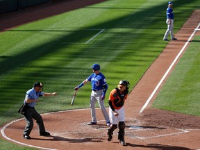 Toronto Blue Jays' Troy Tulowitzki, second from bottom left, tosses his bat after striking out with the bases loaded in front of home plate umpire Dan Iassogna, left, and Baltimore Orioles catcher Matt Wieters to end the third inning of a baseball game in Baltimore, Saturday, June 18, 2016. (Patrick Semansky/AP)