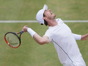 Britain's Andy Murray serves to Canada's Milos Raonic during their final tennis match at Queen's Championships London, England, Sunday June 19, 2016.