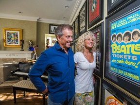 Mike Wilson and partner Debra Thuet look at a Beatles poster for the band's Aug. 17, 1966 concerts in Toronto at Maple Leaf Gardens. The poster is now on display at the St. Lawrence Market Gallery as part of Beatles 50 T.O. (Ernest Doroszuk/Toronto Sun files)