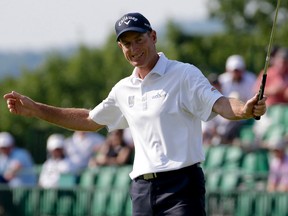 Jim Furyk reacts after making a birdie putt on the 17th hole during the final round of the U.S. Open golf championship at Oakmont Country Club on Sunday, June 19, 2016, in Oakmont, Pa. (AP Photo/Gene J. Puskar)