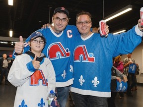 Fans of the former NHL team the Quebec Nordiques enjoy the atmosphere during the NHL pre-season game between the Montreal Canadiens and the Pittsburgh Penguins at the Videotron Centre on September 28, 2015 in Quebec City, Quebec, Canada. The Montreal Canadiens defeated the Pittsburgh Penguins 4-1.  (Photo by Minas Panagiotakis/Getty Images)