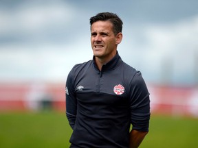 Team Canada coach John Herdman watches his team during a training session before Tuesday's matchup against Brazil, at TD Place Stadium in Ottawa on Monday, June 6, 2016. (Justin Tang)