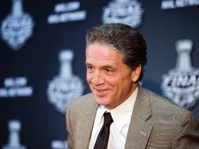 Los Angeles Kings GM Dean Lombardi smiles during a news conference in L.A. on June 3, 2014. (THE CANADIAN PRESS/AP Photo/Jae C. Hong)