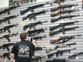 File photo - Guns are displayed inside a store on June 17, 2016 in Lake Barrington, Illinois. Scott Olson/Getty Images/AFP