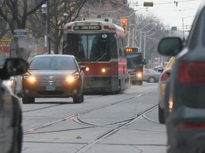 A TTC streetcar along Queen St. E. in Toronto. (Stan Behal/Toronto Sun)