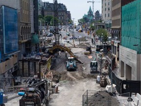 Work to repair the massive sinkhole on Rideau Street continued on Monday, June 20, 2016. ERROL MCGIHON / .