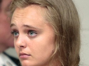 In this Aug. 24, 2015 file photo, Michelle Carter listens to defense attorney Joseph P. Cataldo argue for an involuntary manslaughter charge against her to be dismissed at Juvenile Court in New Bedford, Mass. Carter, a teenager from Plainville, Mass., is charged with involuntary manslaughter in the 2014 death of 18-year-old Conrad Roy III. If the court agrees to send the case to juvenile court, prosecutors have until Aug. 11, 2016, to put her on trial. That's the day Carter turns 20, when she will age out of the juvenile system. (Peter Pereira/Standard Times via AP, File)