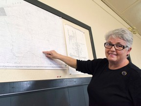Debbie Bauer, one of the founding members of the East Ashfield History Book Committee, shows on a photocopy of an old map the location the book they are compiling information for will cover. (Darryl Coote/Reporter)