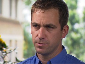 In this grab taken from pool video, Brendan Cox - the husband of MP Jo Cox takes part in a televised interview, Tuesday, June 21, 2016, in London. Cox believes his wife was killed because of her "strong political views." Jo Cox, a Labour lawmaker who had championed the cause of Syrian refugees, was stabbed and shot to death outside a library in her constituency on Thursday. (Pool via AP)