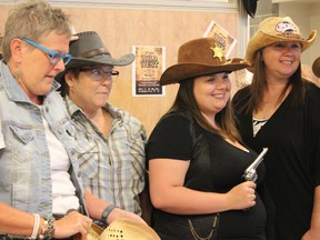 Samantha Reed/The Intelligencer
Members of the BGH Gala Committee Margie Burness (left) and Rachel Pearsall (centre right) celebrate with other members of the committee dressed in Wild West themed clothing as they announce this year's BGH gala theme will be The Wild West.