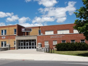The front entrance of Queen Elizabeth Collegiate Vocational Institute in Kingston, Ont. seen on Tuesday June 21, 2016. The secondary school will be closing this month to make room for a new consolidated intermediate and secondary school tentatively scheduled to open for the 2018-2019 school year. Julia McKay/The Whig-Standard/Postmedia Network