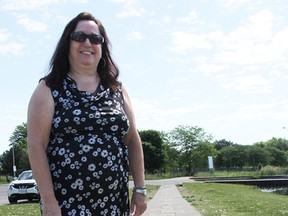 Lori Hare stands by her stone at the Footsteps, Tribute to Courage path by Sarnia Bay. The path, built by the Sarnia-Lambton Sexual Assault Survivors' Centre in 2005, is being moved to Centennial Park. Tyler Kula/Sarnia Observer/Postmedia Network