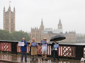 Campaigners hold placards for 'Britain Stronger in Europe', the official 'Remain' campaign group seeking to avoid a Brexit, ahead of the forthcoming EU referendum, in London on June 20, 2016. (JUSTIN TALLIS/AFP/Getty Images)