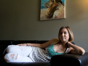 Jillian Di Bernardo, who received a life-saving liver transplant in March, lies on a couch in the living room of her home in London, Ont. on Tuesday May 31, 2016. Di Bernardo became known in the community during her search for a liver donor last year.  Craig Glover/The London Free Press/Postmedia Network