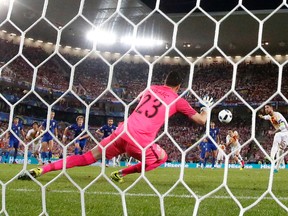 Croatia goalkeeper Danijel Subasic, foreground, stops a penalty kick from Spain’s Sergio Ramos during their Euro 2016 match at the Nouveau Stade in Bordeaux, France, Tuesday, June 21, 2016. (AP Photo/Manu Fernandez)