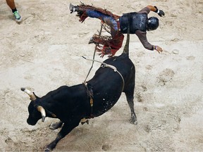 Jeffrey Ramagos is bucked off Little Caesar at the Professional Bull Riders event at Germain Arena, Friday, July 31, 2015, in Estero, Fla.