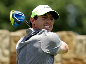 In this Saturday, June 18, 2016 file photo, Rory McIlroy, of Northern Ireland, watches his tee shot on the ninth hole during the rain delayed second round of the U.S. Open golf championship at Oakmont Country Club, in Oakmont, Pa. McIlroy says he will not be competing in the golf tournament at the Rio de Janiero Olympics because of concerns over the Zika virus, it was reported Wednesday, June 22, 2016. (AP Photo/Charlie Riedel, File)