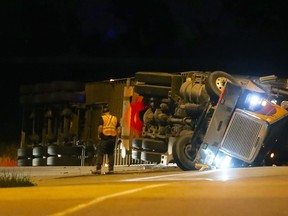 Emergency services responded to the eastbound Highway 401 Gardiners Road exit for a transport truck roll-over in Kingston, Ont. on Tuesday June 21, 2016. Elliot Ferguson/Kingston Whig-Standard/Postmedia Network